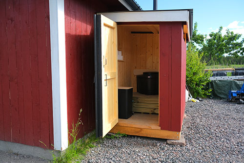 Dry toilet on a red cabin avaiable for guests staying on a tentsile